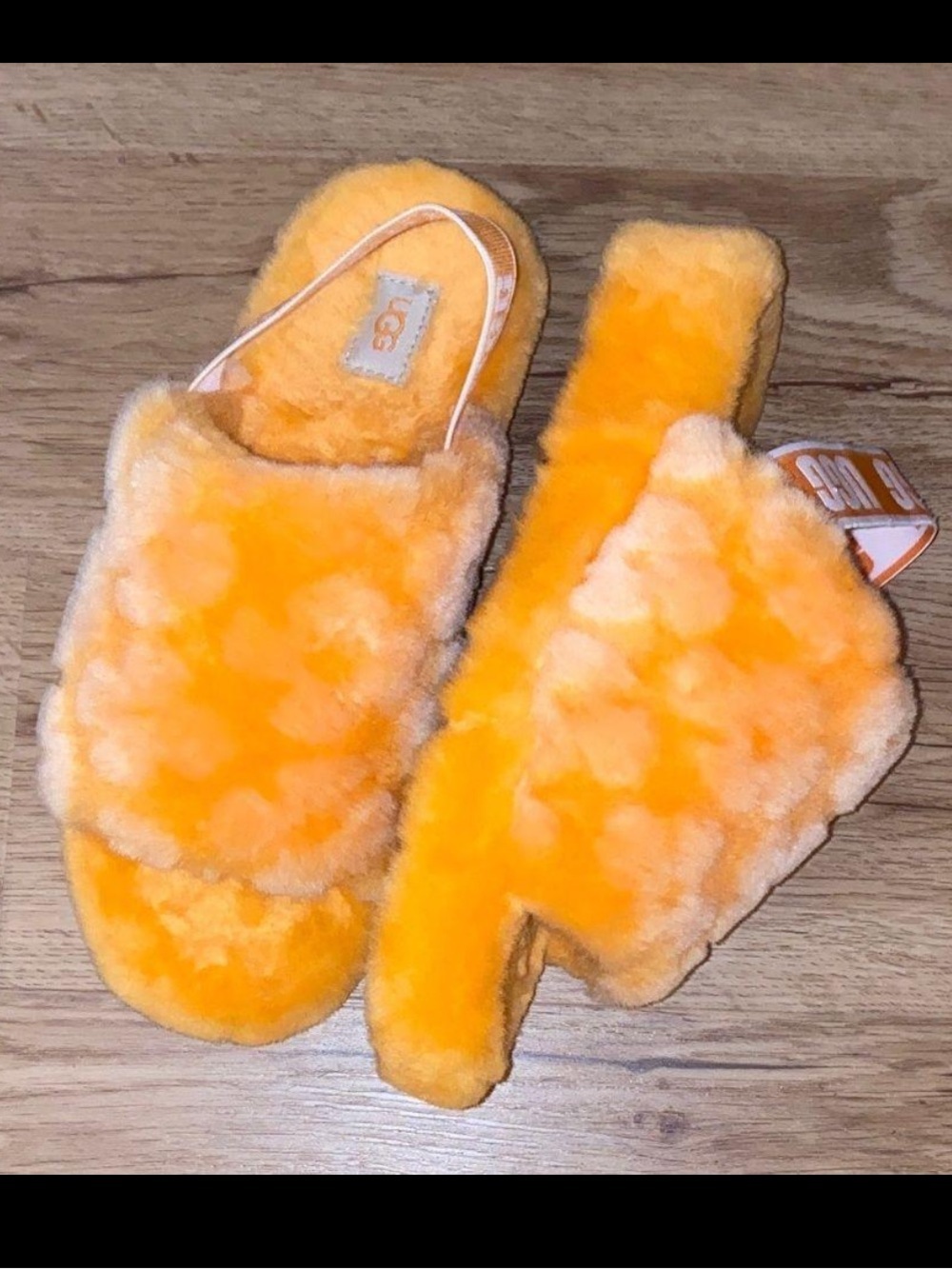 UGG 9Fluff Yeah Poppy Slide Slippers in a vibrant orange color with a plush shea